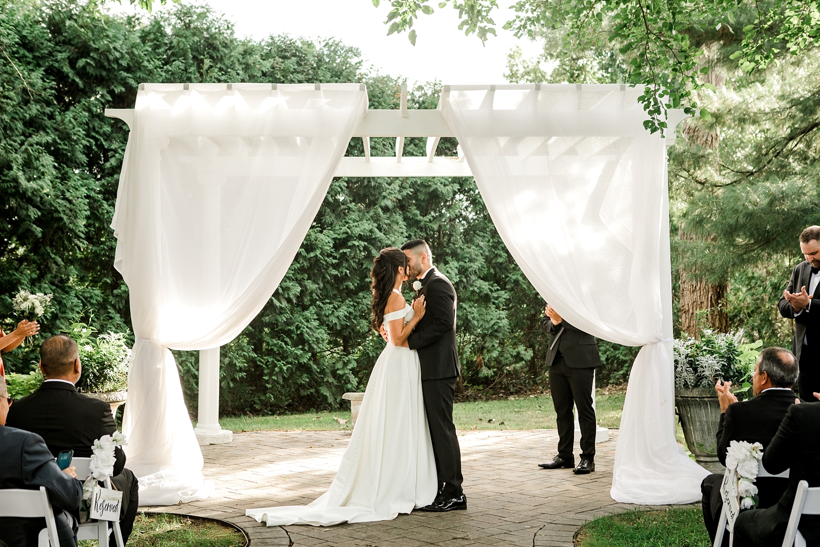 Wedding ceremony kiss at Farmington Gardens